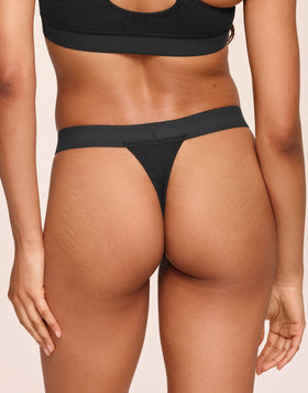 nueskin Tess Rib Cotton Mid-Rise Thong in color Jet Black and shape thong